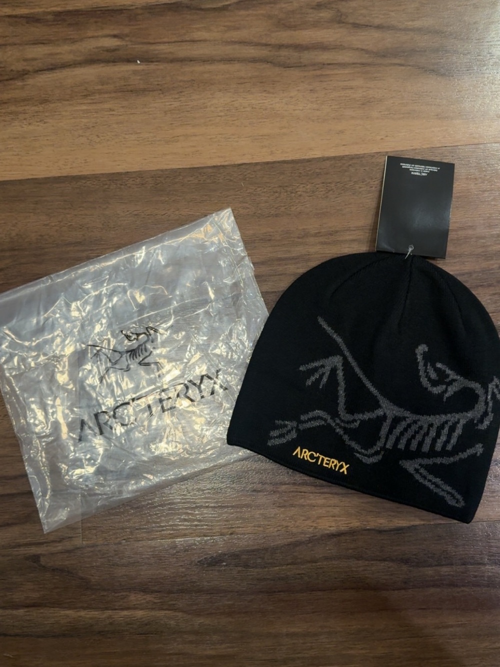 Arc'teryx Black Beanie with Gray Graphic and Gold Logo